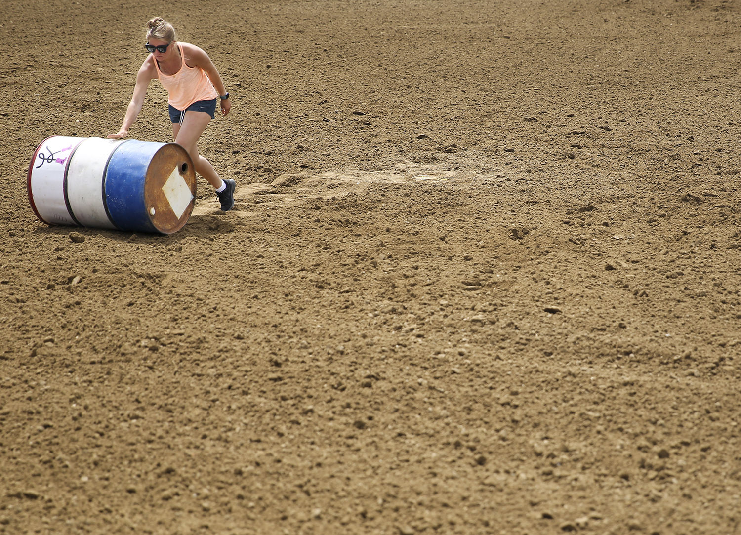 Isolina Nimick roles one of the three barrels away from its spot in middle of the arena